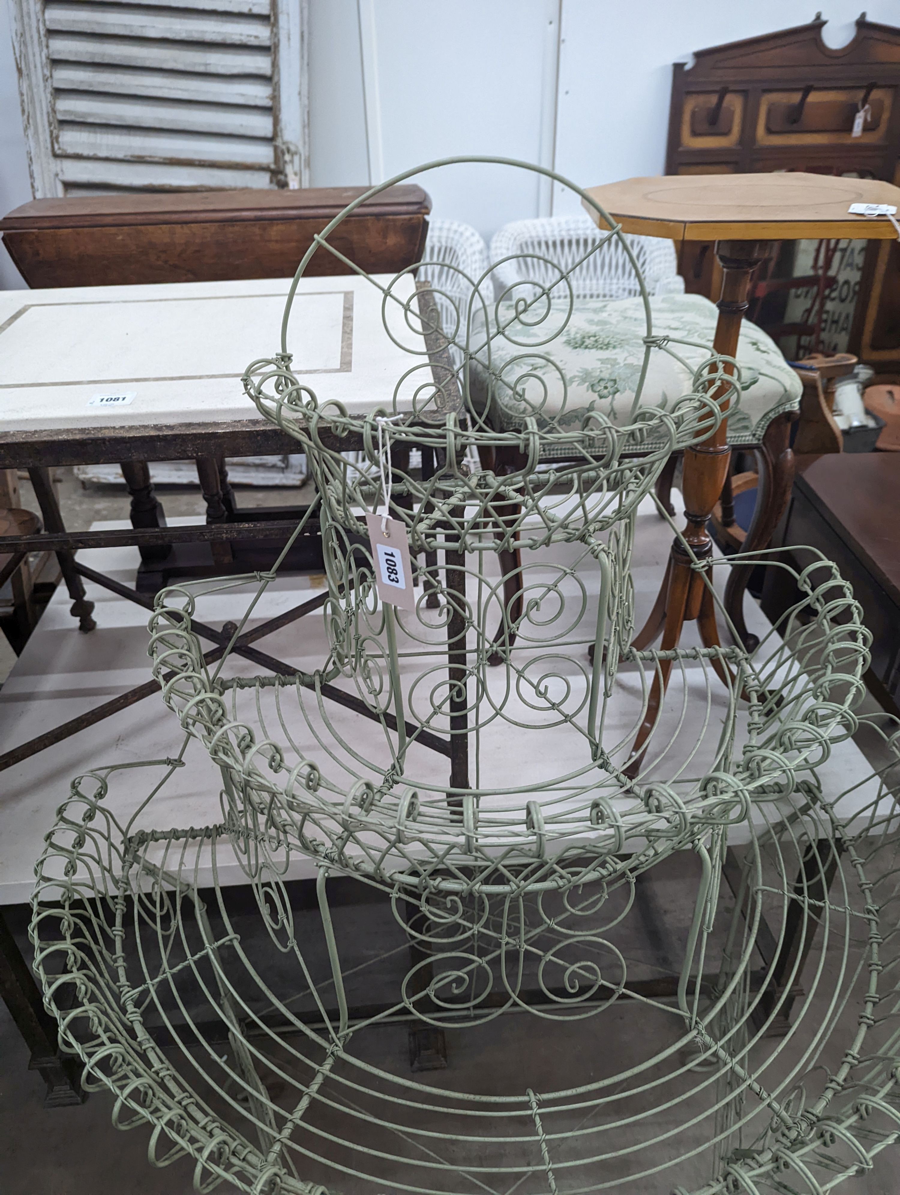 A Victorian style painted wirework plant stand, width 84cm, depth 54cm, height 130cm
